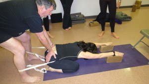 Adhomukha Virasana with blocks and yoga strap