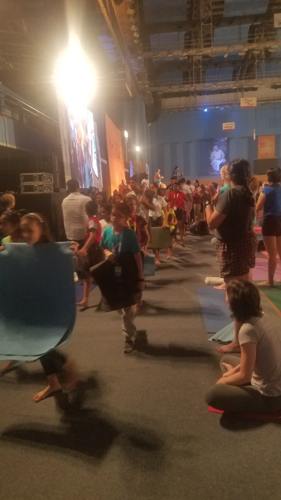About 50 children of all ages filing in for class on Sunday Dec 9 at the Conference.  Geetaji took us through about 40 mins after asanas as taught to children... Not for the light hearted!!! Great class!